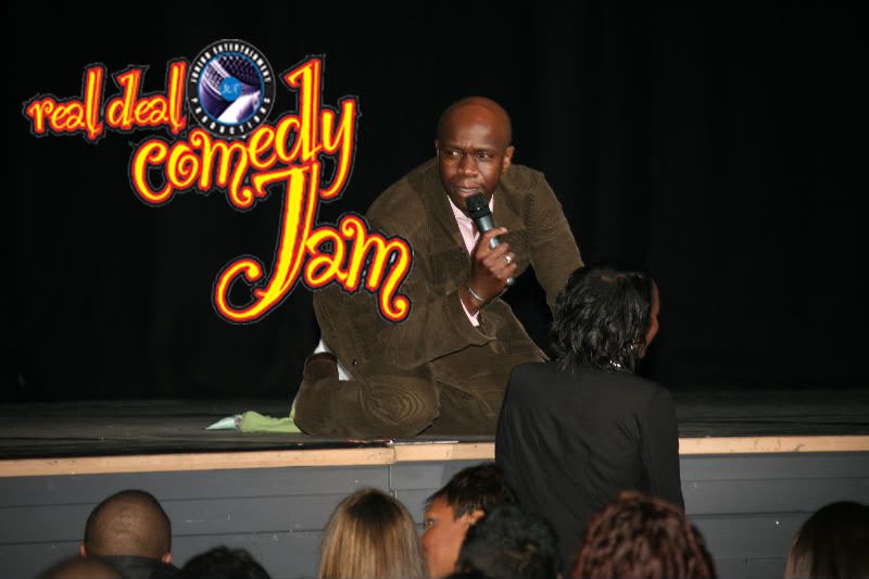 Comedian performing on stage at a Real Deal Comedy Jam night